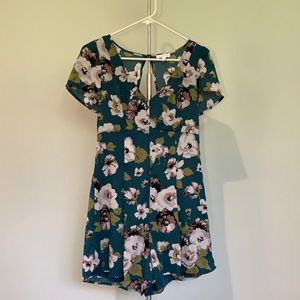 floral romper w/open back w/a bow.worn once